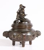 A Japanese bronze censer, Edo period, the lid surmounted by a figure holding a bowl and staff