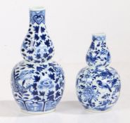 Two Chinese porcelain double gourd vases, both bearing the Kangxi four character mark but later, the