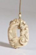 A Chinese 'chicken bone' jade 'chilong' pendant, Song Dynasty (960 AD-1279 AD) with the encircling