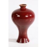 A Chinese meiping monochrome copper red glaze porcelain vase, Qianlong mark but not of the period,