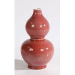 A Chinese double gourd monochrome blush pink porcelain vase, with a small rim above the double gourd
