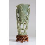 A large Chinese pierced jade Magnolia cup, late Ming Dynasty, 17th Century, of tall slender form,