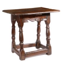 A Charles I oak table-stool, West Country, circa 1640 Having a twin-boarded top, with double-