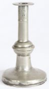 A William & Mary pewter ball-knop candlestick, circa 1690 Having a broad flat flange, and stem