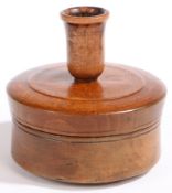 An extremely rare early 19th century beech canister-form tinder box socket candlestick, English,