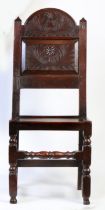 A Charles II oak backstool, Cheshire/Lancashire, circa 1670 With characteristic tall arched and