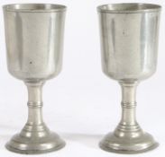 A pair of George III pewter communion cups, circa 1815 Each having a deep and straight-sided