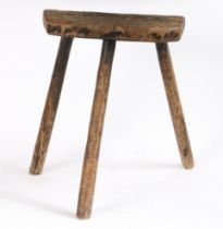 An early 19th Century ash cutlers' stool, Sheffield Having three ribbed splayed legs, morticed