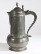 A George II pewter OEWS gallon spouted acorn-shaped knopped flagon, York, circa 1750 The body of