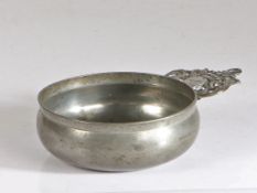 An late 18th century pewter porringer, American, circa 1790 Having a bellied bowl, bossed base and