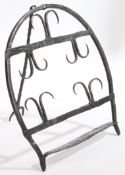 A 19th century wrought iron bread warmer or ‘hanan’, Irish Of horseshoe design, with two rows of