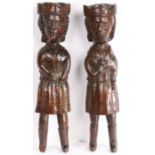 A rare pair of 16th/17th century carved oak figures, a king and queen, English or Welsh, circa