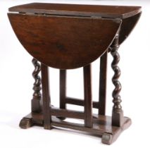 A Charles II oak gateleg occasional table, with rare cut-out platform stretcher, circa 1680 Having