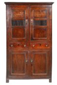 A George III oak ‘bread and cheese' cupboard, North Wales, circa 1800-20 Having a pair of cupboard