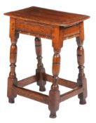 A Charles I oak joint stool, circa 1630 Having a triple-reeded top, the rails of rare design, namely