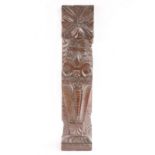 An Elizabeth I oak pilaster, circa 1600 Designed with tobacco leaves and petals, atop a scroll-