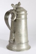 A rare Queen Anne pewter ‘transitional’ flagon, circa 1705 Having a tapering straight-sided body