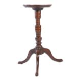 A George I/II yew tripod candlestand, circa 1720-50 Having a one-piece burr circular top with