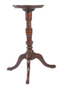 A George I/II yew tripod candlestand, circa 1720-50 Having a one-piece burr circular top with