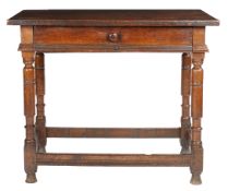 A Charles I oak side table, circa 1640 Having a twin-boarded top with square-edge, a flush frieze