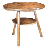 A George III primitive sycamore and ash two-tier cricket table. circa 1760 Having a thick circular