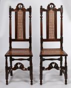 A rare pair of William and Mary yew/cedar and cane high-back side chairs, circa 1690 Each with a