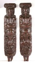 An unusual pair of late 16th century oak figural terms, circa 1580 One male, the other female,