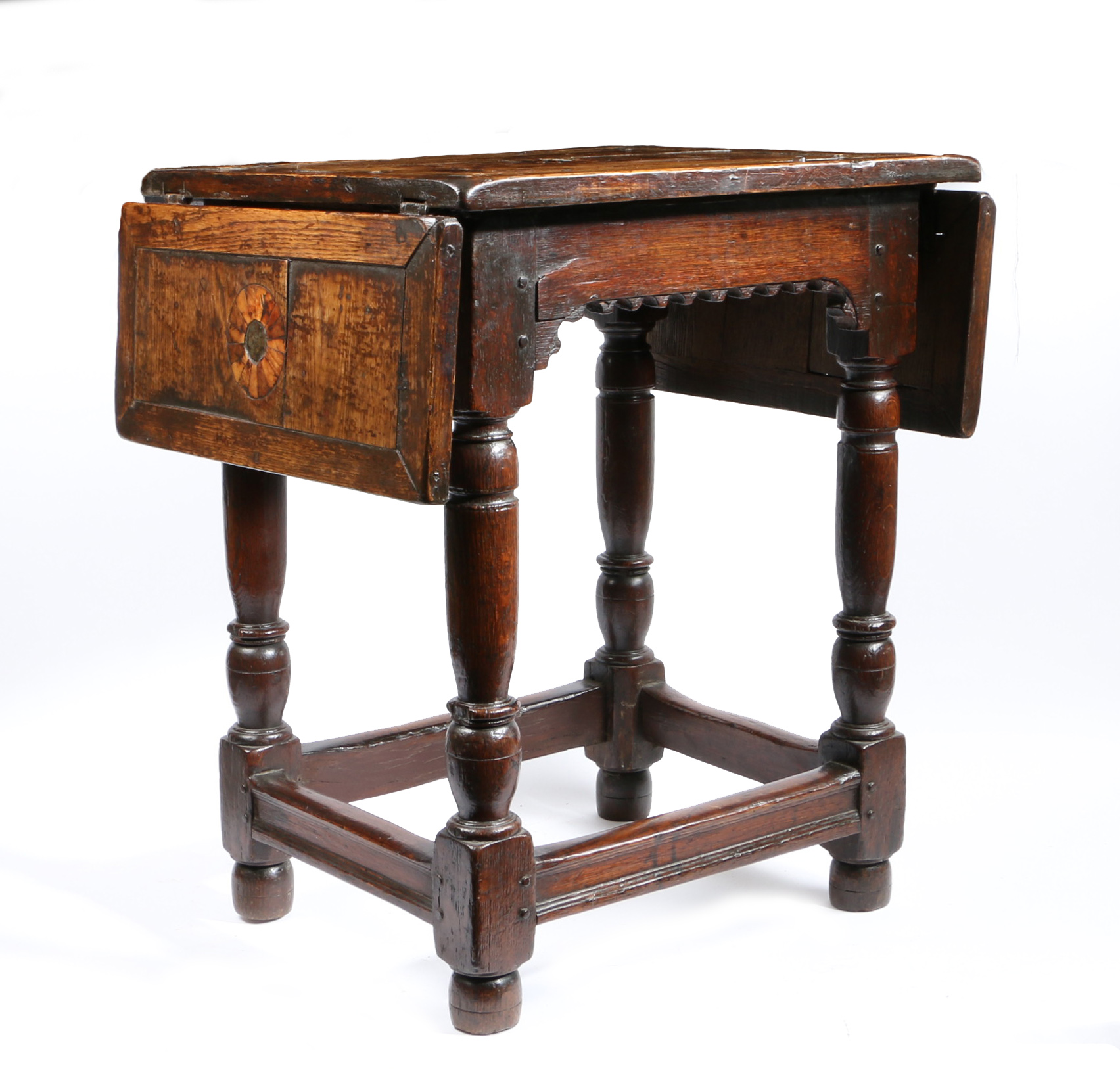 A part Elizabeth I oak and inlaid drop-leaf centre table, circa 1580 and later The top geometric