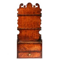 A George III oak and mahogany inlaid spoon rack, Lancashire, circa 1800 Having a tall one-piece