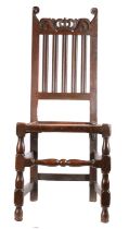 A late 17th century oak side chair, English, circa 1685 Having a lathe back, with a pierced and