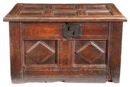 A rare Elizabeth I/James I oak table-chest, West Country, circa 1600-20 Having a six-panelled lid,