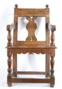 An unusual mid-17th century oak open armchair, English, possibly Devon Having an open back with