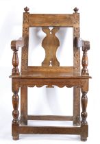 An unusual mid-17th century oak open armchair, English, possibly Devon Having an open back with