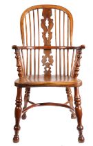 An early 19th century yew high-back Windsor armchair, Nottinghamshire, circa 1830 The hooped back