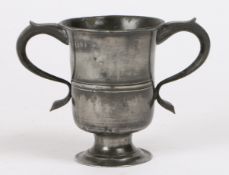 A George II pewter OEWS pint twin-handled footed cup, Yorkshire, circa 1735 Having a relatively