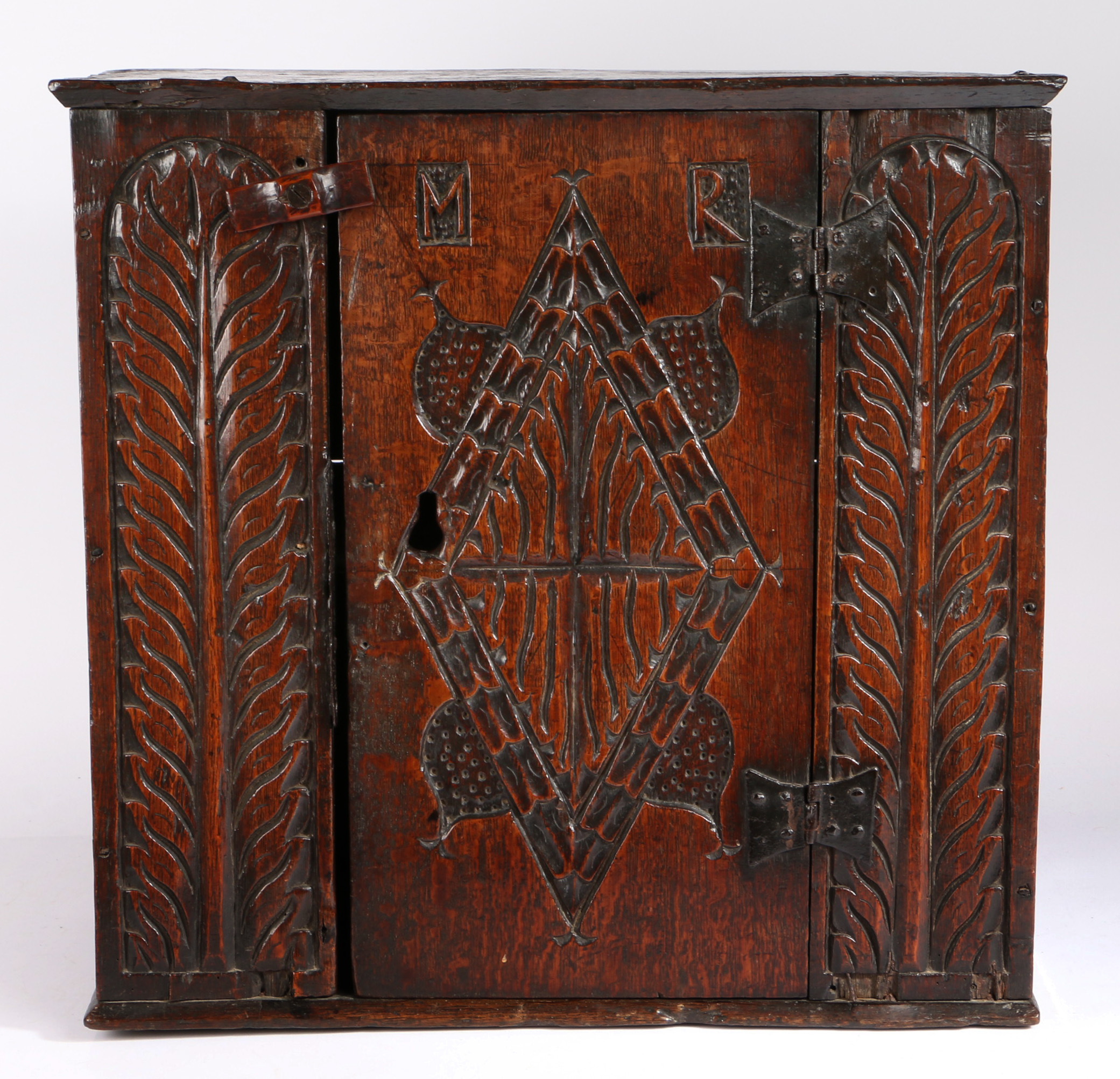 A rare Charles I oak boarded mural cupboard, Gloucestershire/Welsh Borders, circa 1630 The top
