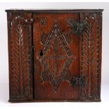 A rare Charles I oak boarded mural cupboard, Gloucestershire/Welsh Borders, circa 1630 The top