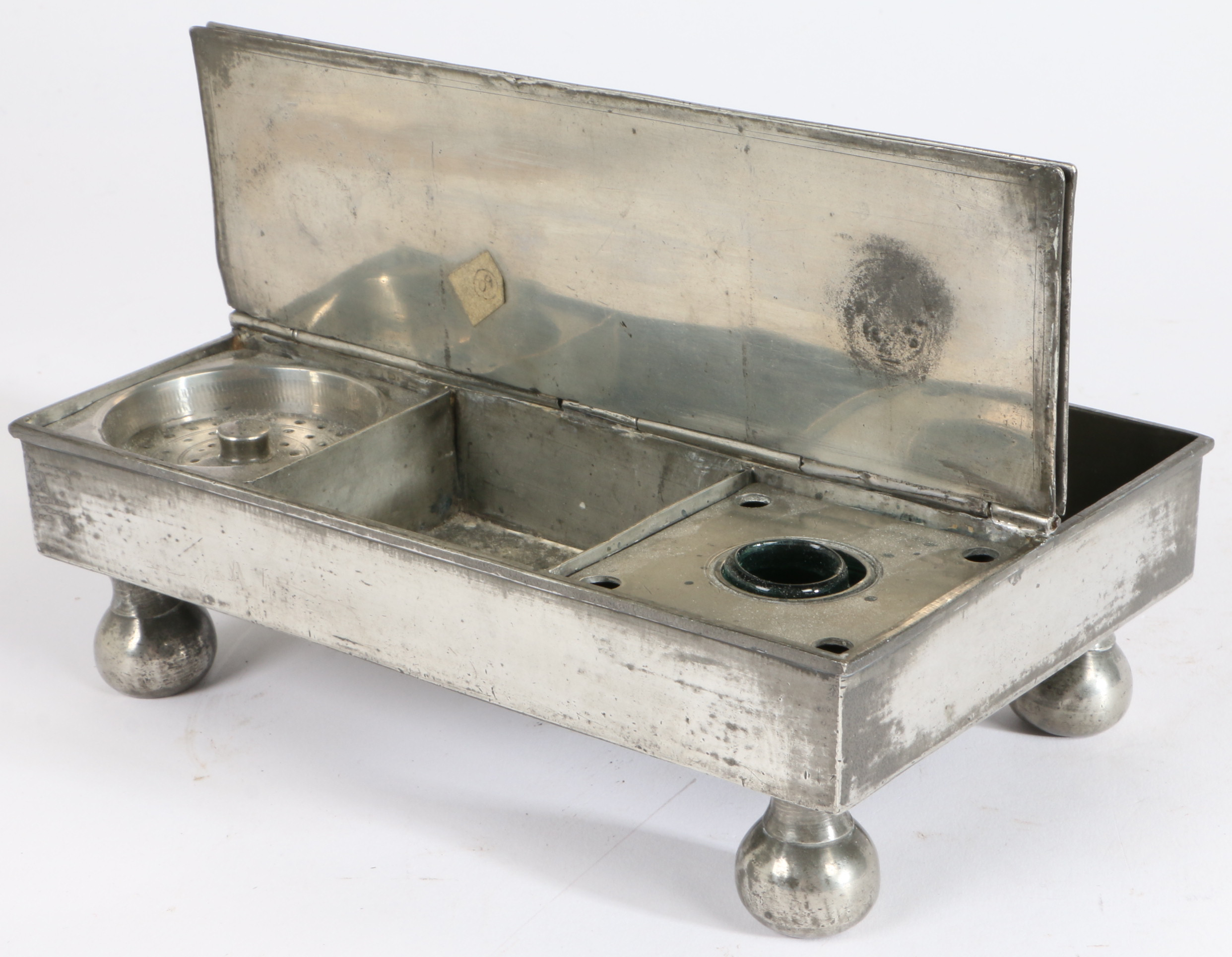 A George III pewter ‘treasury' inkstand, circa 1800 Of typical flat rectangular twin-flap form,