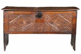 A rare Henry VIII oak boarded chest, with traces of polychrome, circa 1540 Having an impressive