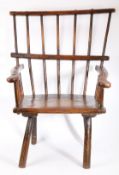 A rare George III ash comb-back primitive Windsor armchair, circa 1800 The back of seven hand-shaped