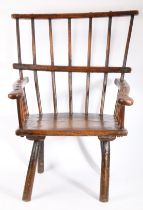 A rare George III ash comb-back primitive Windsor armchair, circa 1800 The back of seven hand-shaped