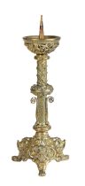 A 19th century Gothic-Revival brass candlestick The pricket top above text and a pierced figural and