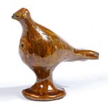 A pottery Halifax slipware whistle, circa 1800 Designed as a standing bird, 18cm long, 15cm high