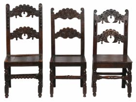 A group of nine Charles II oak backstools, Yorkshire, circa 1670 Each with paired arched splats,
