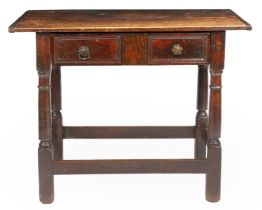 A Charles II oak and yew side table, circa 1660 Having an end-cleated twin-boarded top, single