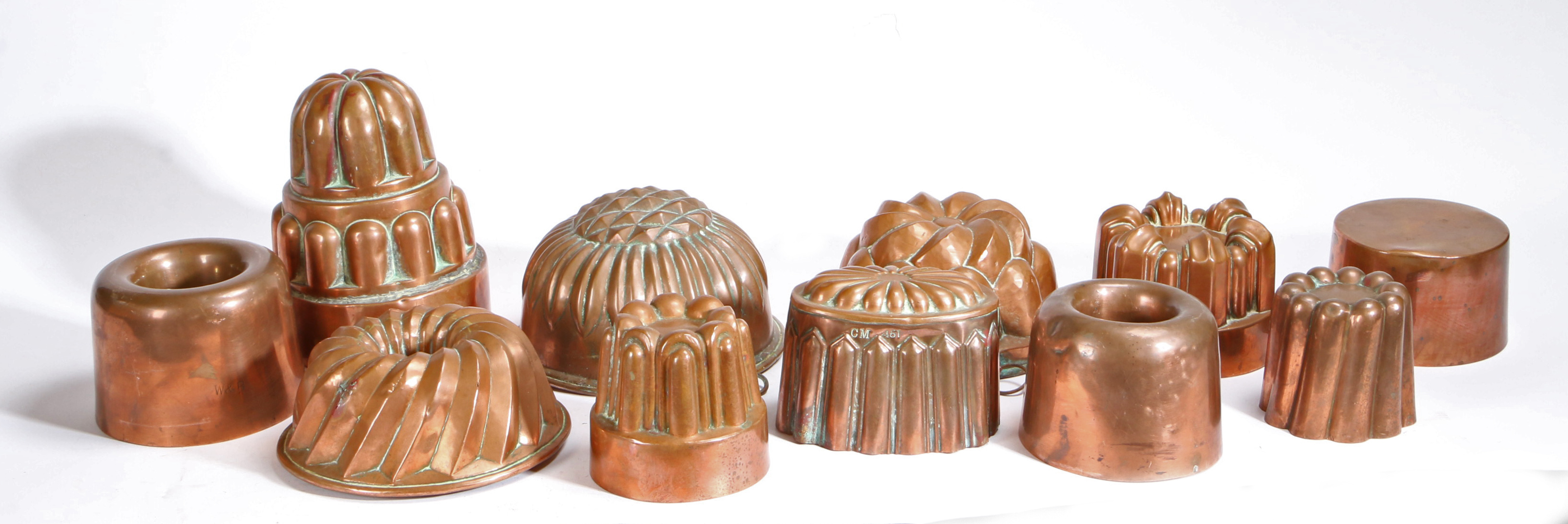 A group of ten 19th century and later copper jelly moulds, English To include lobed, fluted turret