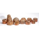 A group of ten 19th century and later copper jelly moulds, English To include lobed, fluted turret