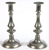 A pair of George III pewter candlesticks, circa 1800 Each of baluster-knopped form, with beaded