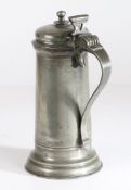 A small Charles I pewter flagon, circa 1630 Having a knopped bun lid, pierced-heart and bar