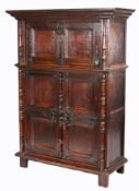 A rare 16th Century oak scribes' cabinet, Flemish Having a boarded fall front, with applied